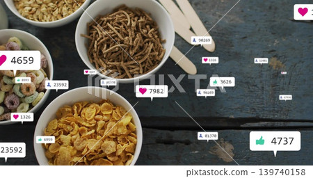 Showing four white cereal bowls on worn blue table with wooden spoons, reaction bubbles, copy space Showing four white cereal bowls on worn blue table with wooden spoons, reaction bubbles, copy space 139740158