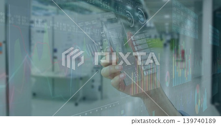 Holding smartphone, single hand with shirt cuff displaying holographic financial charts in office Holding smartphone, single hand with shirt cuff displaying holographic financial charts in office 139740189