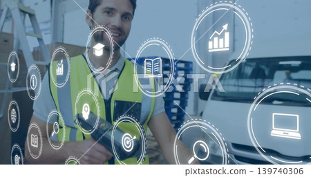 Scanning warehouse worker in high-vis vest holding handheld scanner at shelves with HUD overlay 139740306