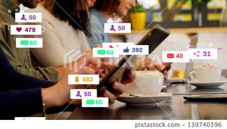 Tapping hands holding tablet, phones at cafe counter, in sweaters, with cups, notifications Tapping hands holding tablet, phones at cafe counter, in sweaters, with cups, notifications 139740396