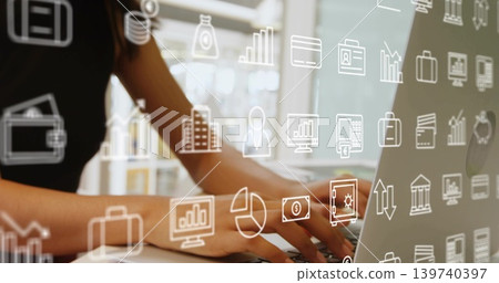 Typing woman wearing sleeveless dark top, using laptop at desk by window, floating finance icons Typing woman wearing sleeveless dark top, using laptop at desk by window, floating finance icons 139740397