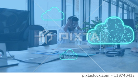 Adjusting man wearing white shirt and sunglasses sitting at wooden table with neon cloud overlays 139740432