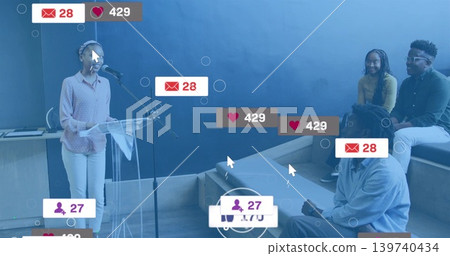 Presenter in pink blouse speaking at mic on lectern in classroom, with social metrics, copy space 139740434