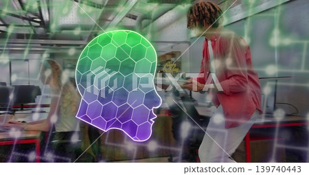 Leaning man in pink shirt holding tablet for seated coworker in open office, neon honeycomb overlay Leaning man in pink shirt holding tablet for seated coworker in open office, neon honeycomb overlay 139740443