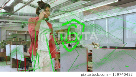 Walking man talking on smartphone in open office wearing red jacket, with green AR S-shield Walking man talking on smartphone in open office wearing red jacket, with green AR S-shield 139740452