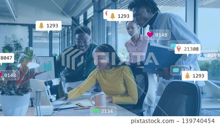 Reaching seated woman in mustard top touching phone at office desk, showing notification icons Reaching seated woman in mustard top touching phone at office desk, showing notification icons 139740454