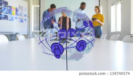 Discussing team in business attire around holographic globe on conference table, tablet visible Discussing team in business attire around holographic globe on conference table, tablet visible 139740574