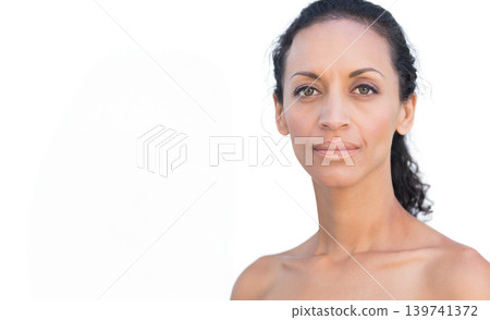 Mid-adult female posing with bare shoulders in studio on white backdrop facing camera, copy space Mid-adult female posing with bare shoulders in studio on white backdrop facing camera, copy space 139741372