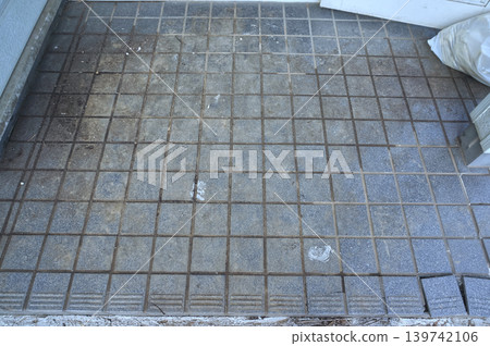 Dirty entrance tiles before cleaning 139742106