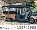 A rusty and abandoned Large multi-seat tuk tuk taxi for tourists in an abandoned hotel. The ruin and bankruptcy of the tourism business during the pandemic and crises. High quality photo 139742988