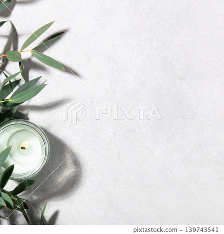 Eucalyptus Leaves and Scented Candle on Minimal Light Background 139743541