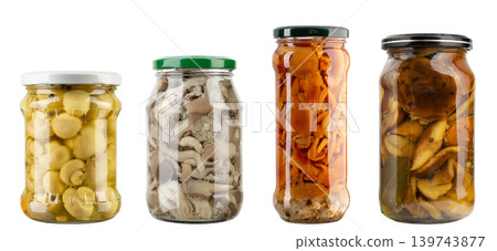 Pickled mushrooms in glass jars isolated on white background, preserved food assortment Pickled mushrooms in glass jars isolated on white background, preserved food assortment 139743877