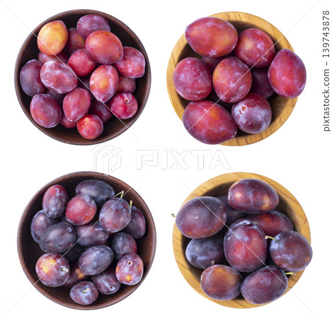Set of various plum varieties in wooden bowls isolated on white background Set of various plum varieties in wooden bowls isolated on white background 139743878