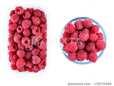 Fresh raspberries in plastic container and glass bowl isolated on white background Fresh raspberries in plastic container and glass bowl isolated on white background 139743890