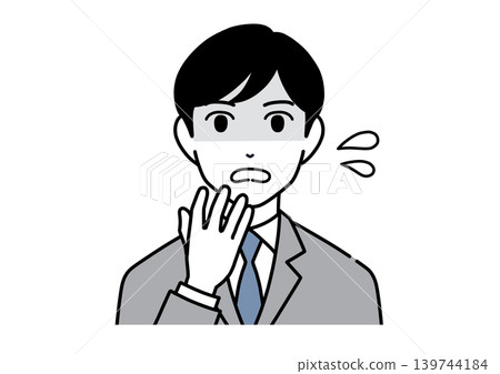A young male office worker in a suit, looking flustered, covers his mouth with his hand. A young male office worker in a suit, looking flustered, covers his mouth with his hand. 139744184