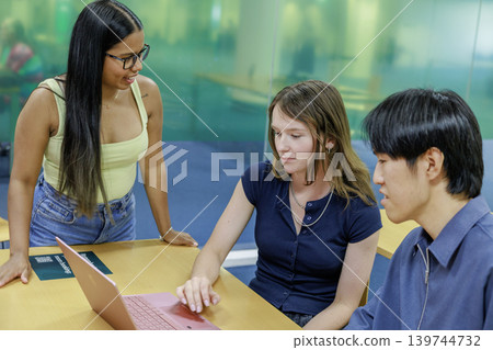Young company employees having a meeting with an international team. 139744732