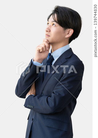 A male businessman thinking A male businessman thinking 139744830