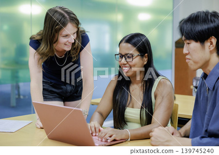 Young company employees having a meeting with an international team. 139745240