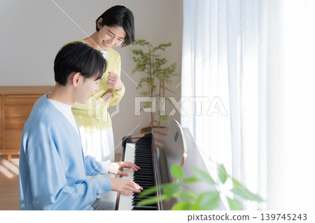 Piano teacher and student Piano teacher and student 139745243