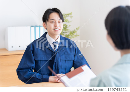 Businessmen in work clothes having a meeting 139745251