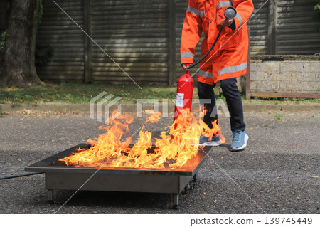 fire prevention. corporate safety - exercise during a firefighting course fire prevention. corporate safety - exercise during a firefighting course 139745449