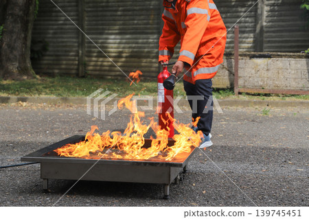 fire prevention. corporate safety - exercise during a firefighting course fire prevention. corporate safety - exercise during a firefighting course 139745451
