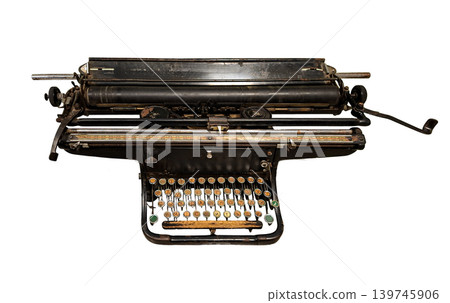 A vintage mechanical typewriter stands alone on a white background. It features keys with the Cyrillic alphabet, ideal for design projects. The typewriter showcases a classic retro look. A vintage mechanical typewriter stands alone on a white background. It features keys with the Cyrillic alphabet, ideal for design projects. The typewriter showcases a classic retro look. 139745906