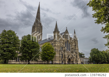 English Gothic architecture of Salisbury Cathedral under cloudy sky English Gothic architecture of Salisbury Cathedral under cloudy sky 139746262