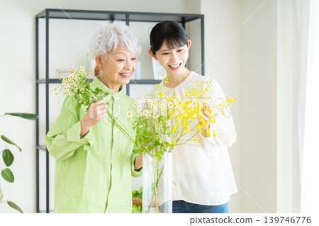 Senior parent and child arranging flowers 139746776