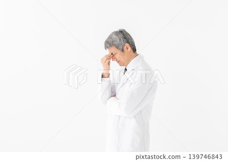 Medical white coat man thinking Medical white coat man thinking 139746843