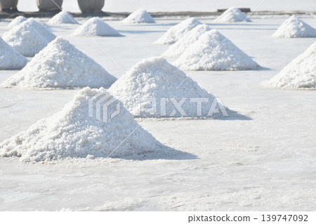 saline water making dry salt by solar evaporation Thai cultures and agriculture manufacturing in farm on sunny day 139747092