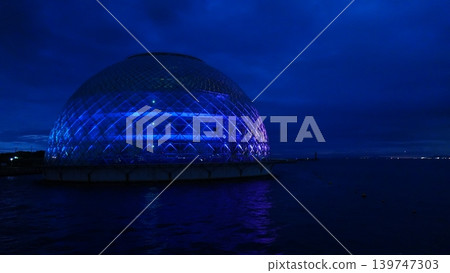 A dome on the sea that is lit up A dome on the sea that is lit up 139747303