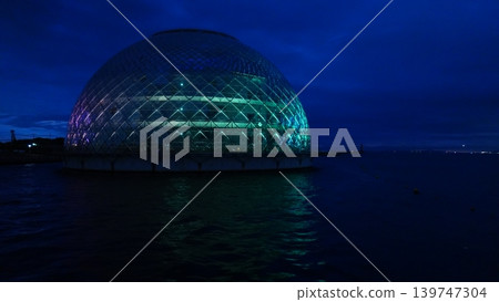 A dome on the sea that is lit up A dome on the sea that is lit up 139747304