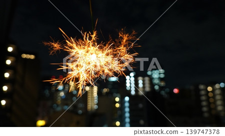 Cityscape and beautiful sparklers Cityscape and beautiful sparklers 139747378