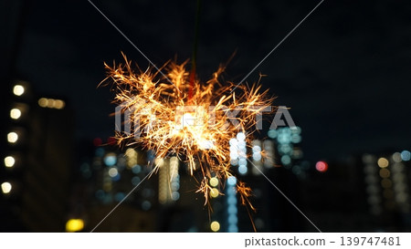 Cityscape and beautiful sparklers Cityscape and beautiful sparklers 139747481