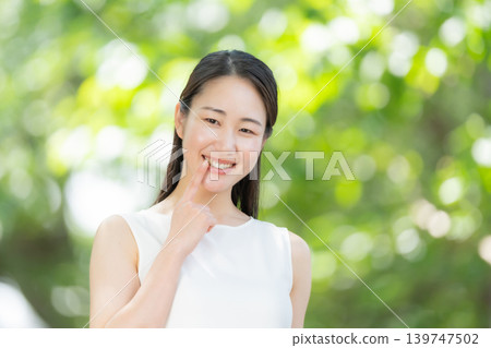 Fresh greenery, woman, beauty, teeth Fresh greenery, woman, beauty, teeth 139747502
