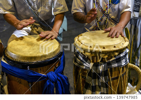 Drummers playing a traditional atabaque Drummers playing a traditional atabaque 139747985