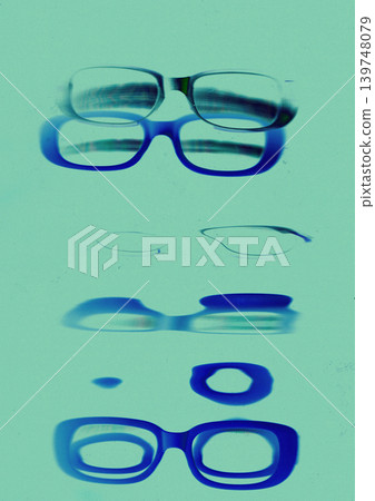 Stylish eyeglasses photogram with vintage film scratches, experimental optical composition, blue cyan negative aesthetic, retro scanography background with blurred glasses frames. Turquoise background Stylish eyeglasses photogram with vintage film scratches, experimental optical composition, blue cyan negative aesthetic, retro scanography background with blurred glasses frames. Turquoise background 139748079