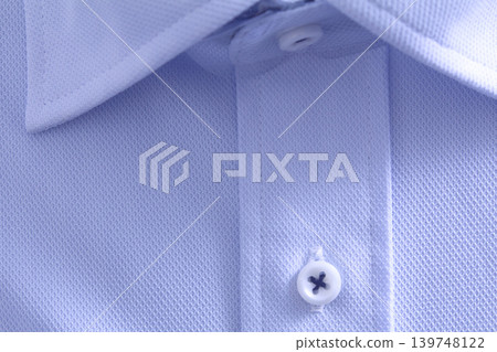 Close-up of the collar of a light blue casual shirt. Close-up of the collar of a light blue casual shirt. 139748122