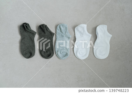 Simple arrangement of everyday socks photographed from above. Suitable for ecommerce and clothing themes. 139748223