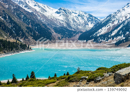 Big Almaty Lake surrounded by snow capped mountains Big Almaty Lake surrounded by snow capped mountains 139749092