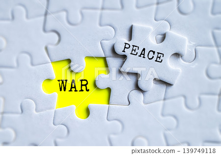 War and Peace yellow puzzle pieces on gray jigsaw background, global conflict resolution and international relations concept War and Peace yellow puzzle pieces on gray jigsaw background, global conflict resolution and international relations concept 139749118
