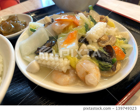 Seafood Eight Treasure Stir-fry: Contains shrimp, squid, and scallops in a white sauce. Seafood Eight Treasure Stir-fry: Contains shrimp, squid, and scallops in a white sauce. 139749323