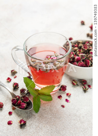 Rose tea infusion with dried buds and fresh mint leaf Rose tea infusion with dried buds and fresh mint leaf 139749383