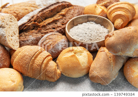 Freshly baked bread and pastries with baking flour Freshly baked bread and pastries with baking flour 139749384