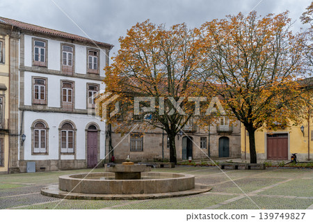 Braga City Square with Yellow Autumn Trees and Fountain Braga City Square with Yellow Autumn Trees and Fountain 139749827