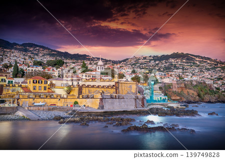 Funchal Skyline and Sea Fort at Magenta Sunset from the Ocean Funchal Skyline and Sea Fort at Magenta Sunset from the Ocean 139749828