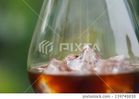 iced coffee poured into a glass iced coffee poured into a glass 139749830