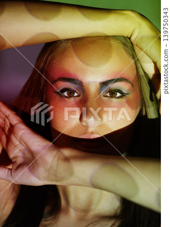 Woman, art and portrait with creativity, lights and pattern projection with cosmetics and beauty. Shadow, confidence and female model with makeup, glow and spotlight with retro fantasy in studio Woman, art and portrait with creativity, lights and pattern projection with cosmetics and beauty. Shadow, confidence and female model with makeup, glow and spotlight with retro fantasy in studio 139750343
