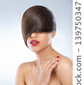 Hair, beauty and hand of woman with manicure in studio on white background for keratin treatment. Face, salon and nails with confident young haircare model for shampoo, cosmetics or hairdressing 139750347